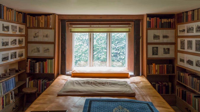 The view from inside the Book Room with the window at the end at Clouds Hill, Dorset